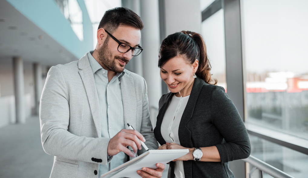 man and woman discussing taxes